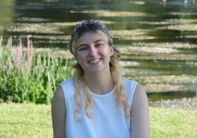 ciara_23 Ciara smiling to camera in front of a pond